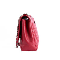 CHANEL - Sac à main Timeless Maxi Jumbo cuir caviar rouge - Hand bag